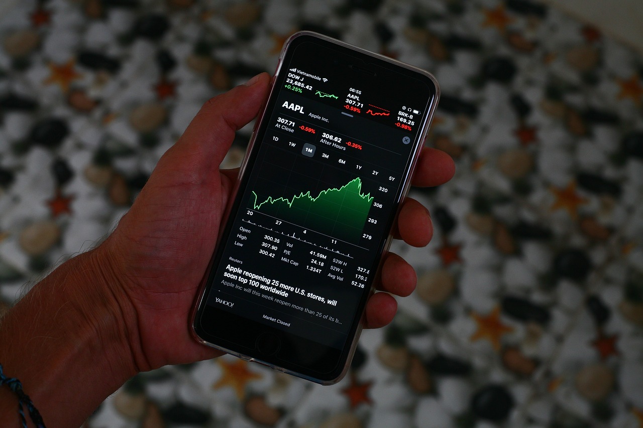 a close up of a person holding a cell phone, a picture, trading stocks, on black background, shot with iphone 1 0, stats