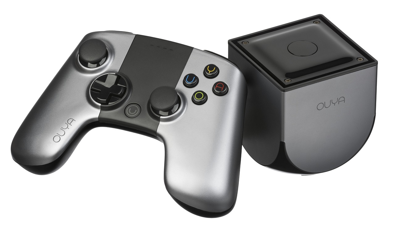 a couple of game controllers sitting next to each other, a digital rendering, by Paul Davis, bauhaus, glass and metal : : peugot onyx, packshot, holding controller, grey and silver