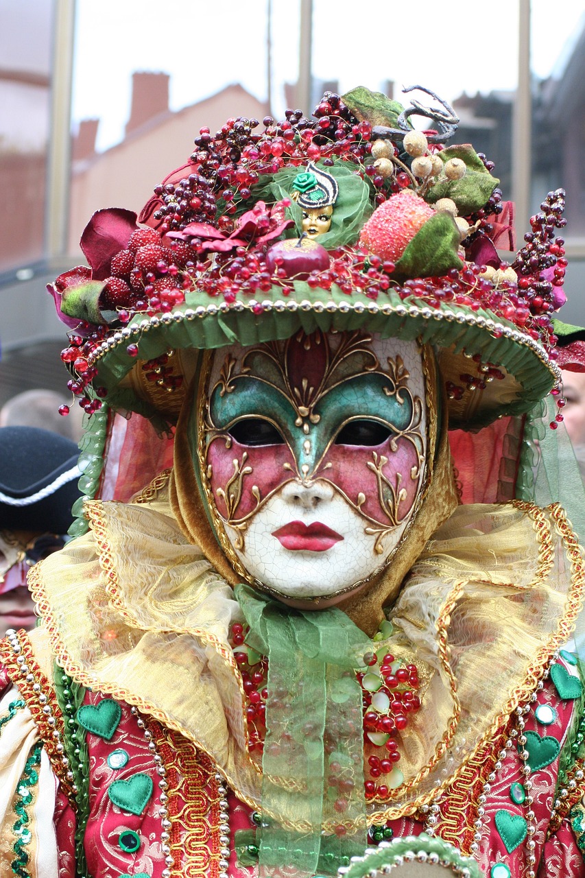 a close up of a person wearing a mask, inspired by Bernd Fasching, shutterstock, renaissance, red and green color scheme, very very beautiful woman, tourist photo, elegant and ornate