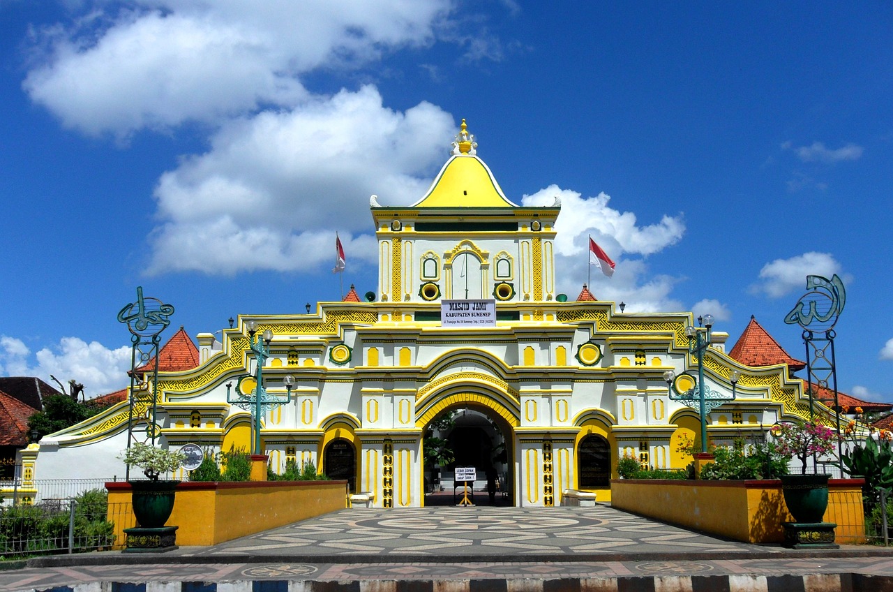 a yellow and white building with a clock tower, by Basuki Abdullah, sumatraism, huge gate, zoo, holy place, image