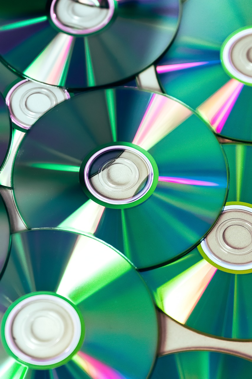 a pile of cds sitting on top of each other, computer art, closeup photo, flash photo, modern high sharpness photo, imdb