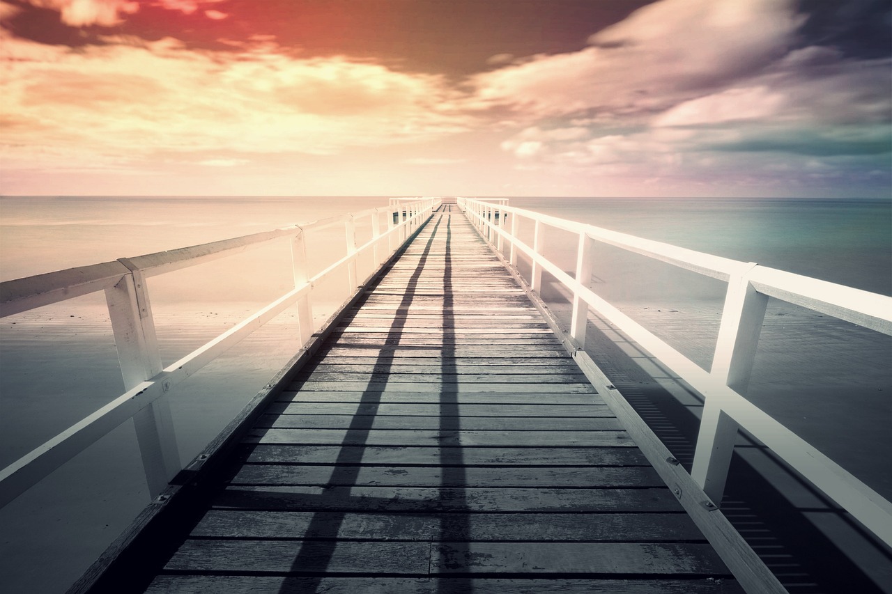 a long pier stretches out into the ocean, by Walenty Wańkowicz, shutterstock, minimalism, light leak, exotic endless horizon, retro effect, perfect symmetrical image