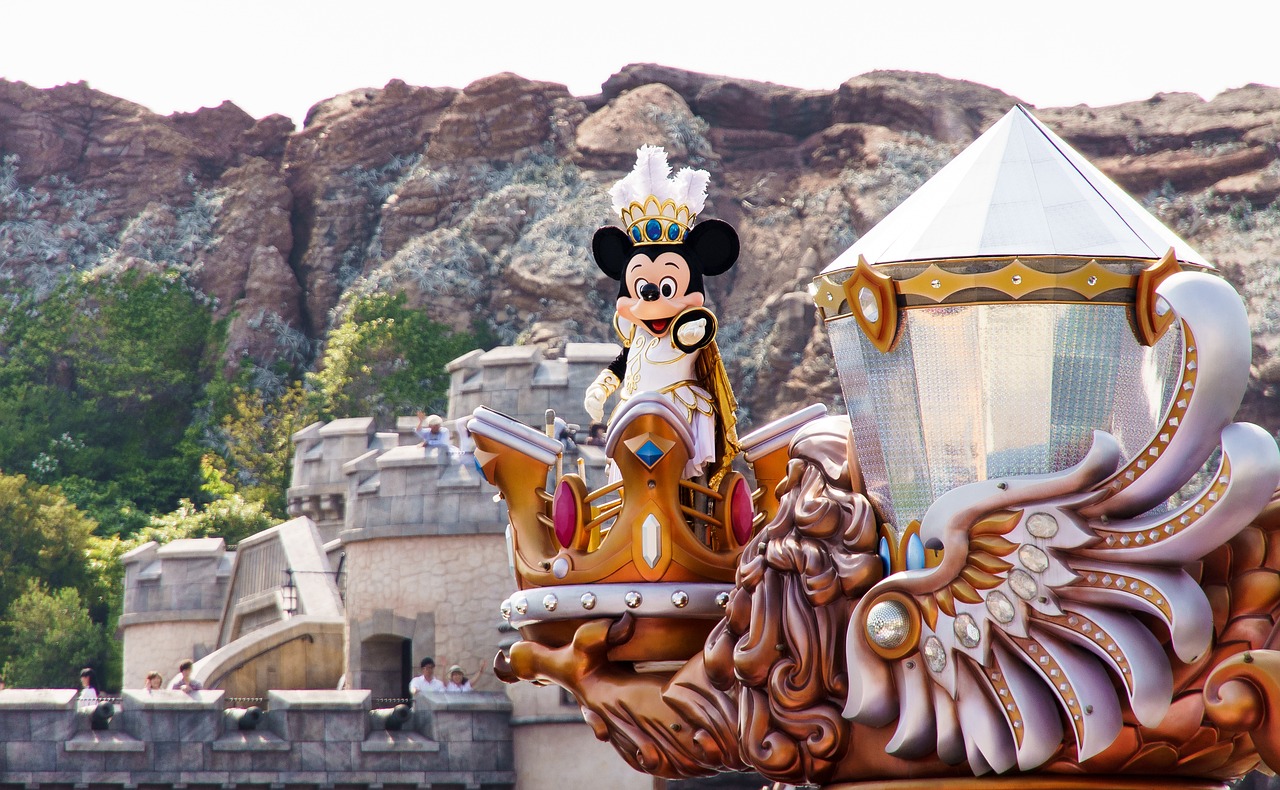a statue of mickey mouse riding on top of a carriage, a picture, tumblr, shin hanga, telephoto vacation picture, floating crown, diva, asterix