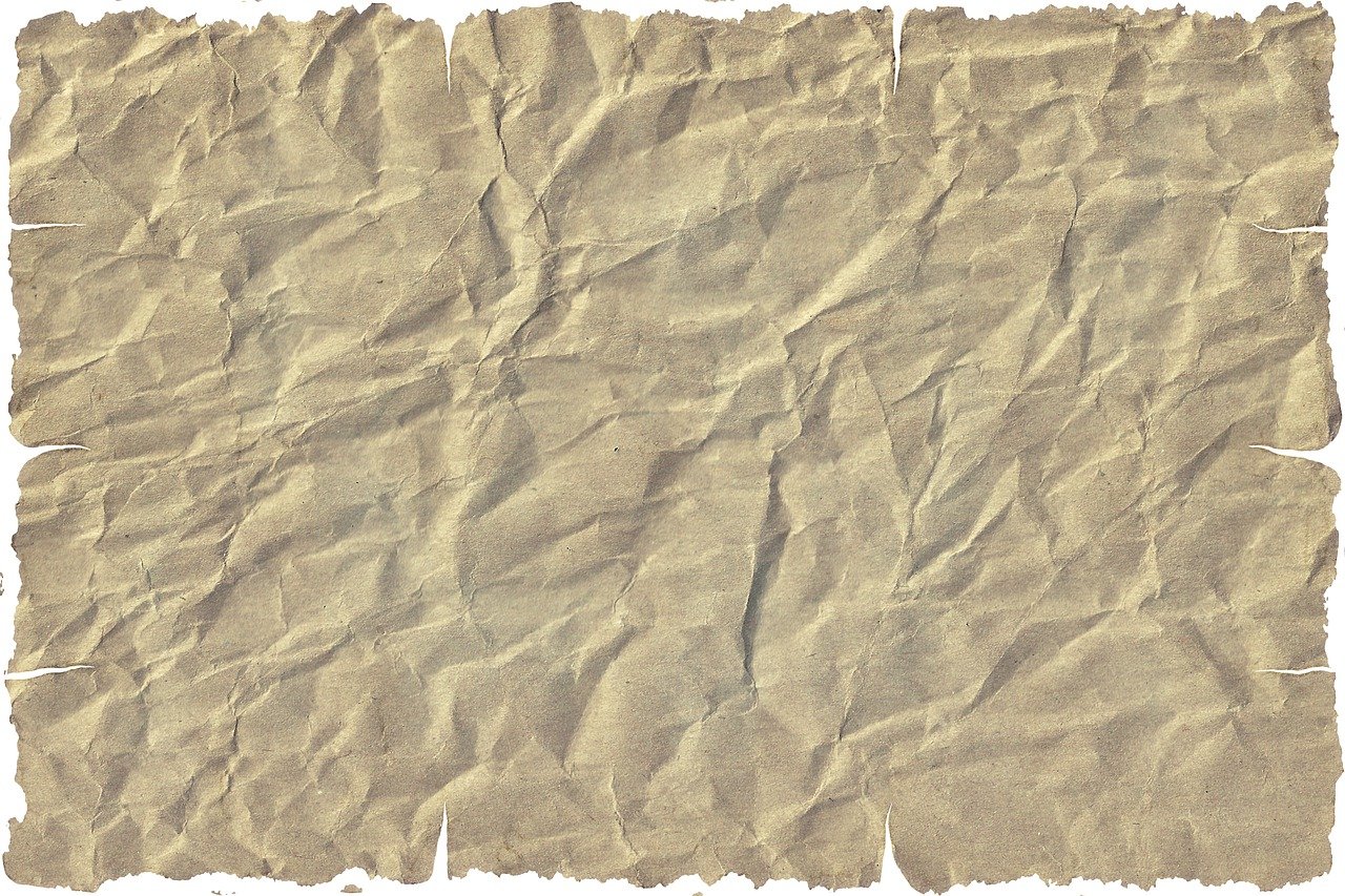 a piece of brown paper on a white background, concept art, by Viktor de Jeney, trending on pixabay, highly detailed texture, wild west background, corrupted file, near the beach