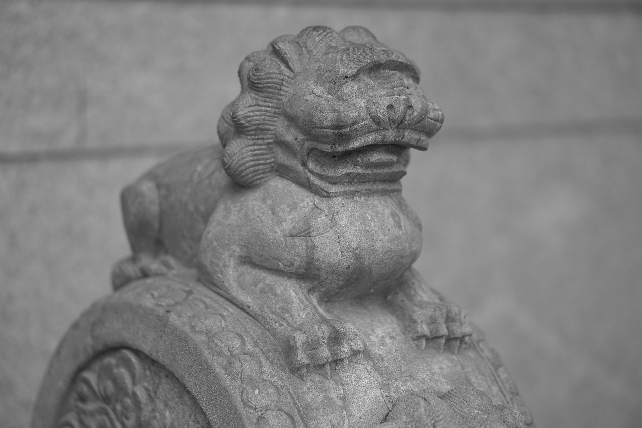 a black and white photo of a statue of a lion, a statue, by Kanō Tan'yū, flickr, sōsaku hanga, detailed smile, subject: dog, gwanghwamun, fake hidden detail