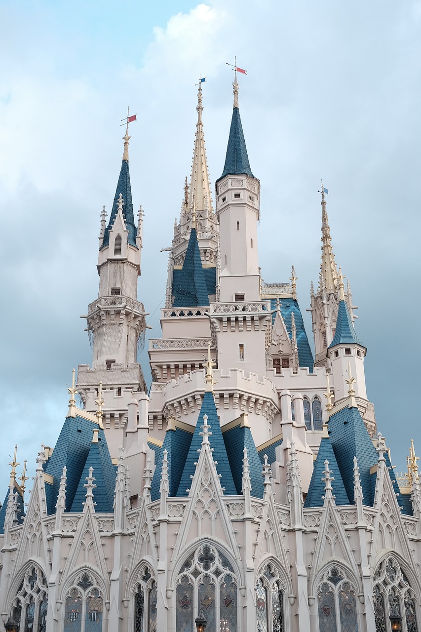 a couple of people that are standing in front of a castle, inspired by disney, pexels, closeup!!!!!!, usa-sep 20, cloud palace, seen from afar