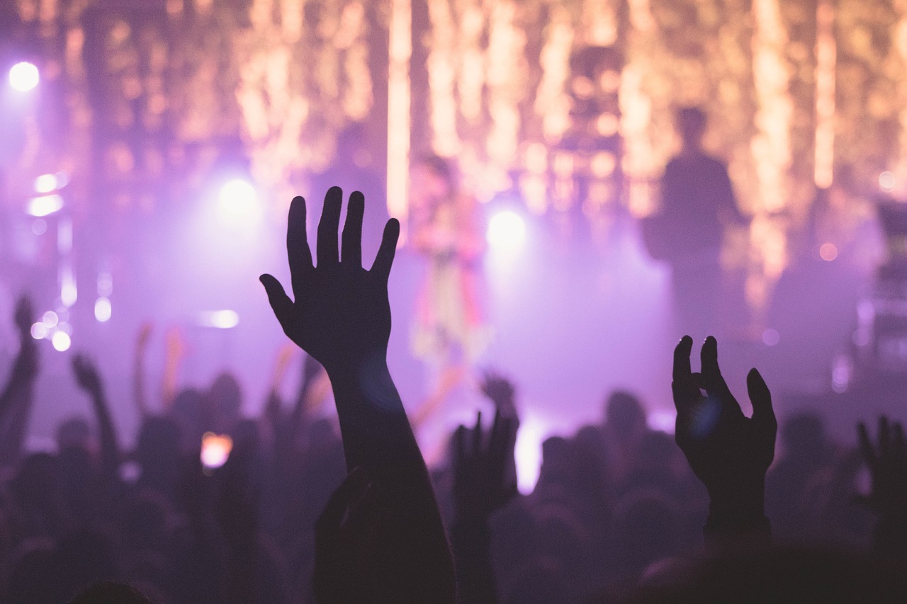 a crowd of people at a concert with their hands in the air, a picture, by Matt Cavotta, uncropped, nightclub background, jesus wasted at a party, header