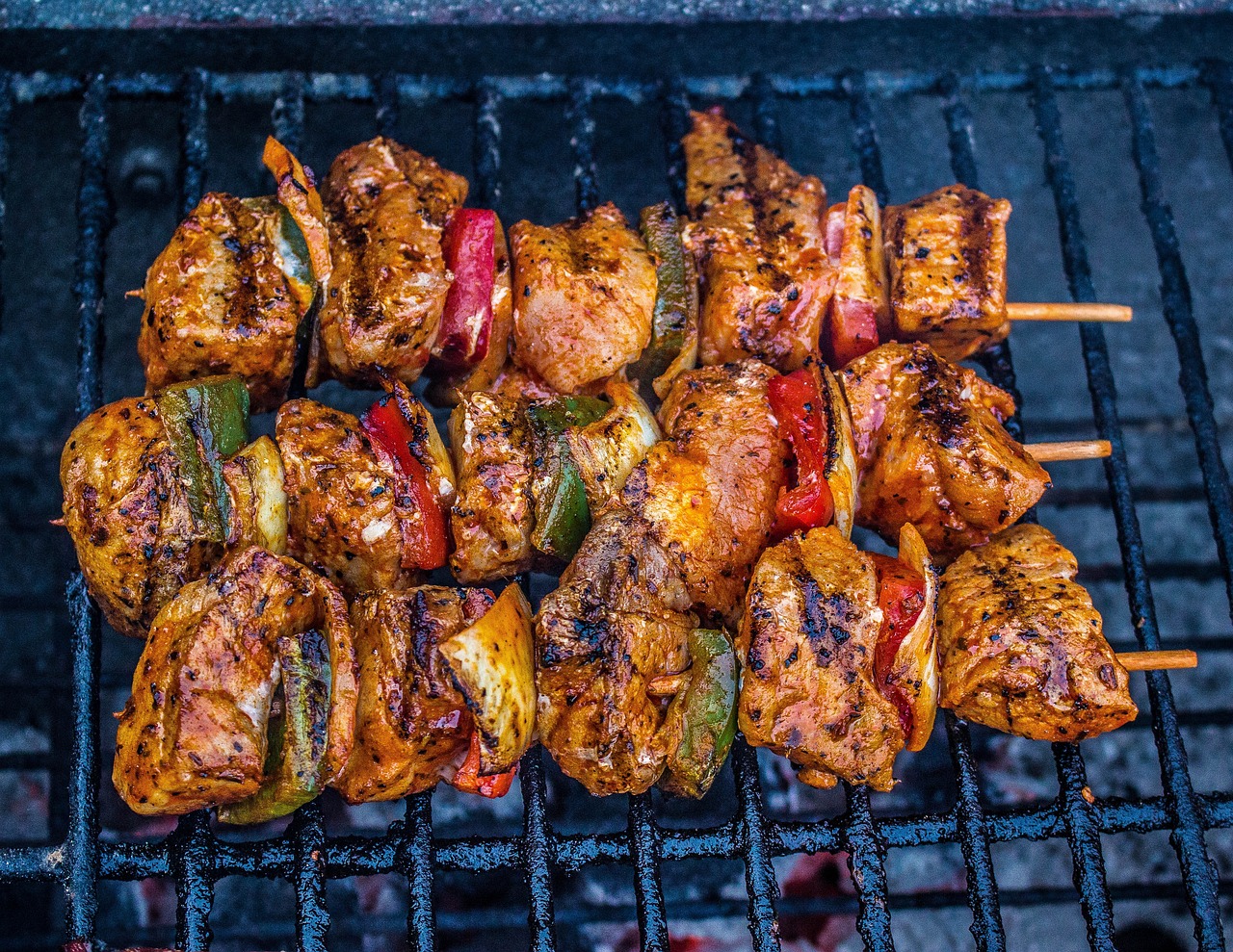 a close up of skewered food on a grill, a portrait, by Alexander Robertson, shutterstock, 🤬 🤮 💕 🎀, chicken, 2 4 mm iso 8 0 0 color, jamaican