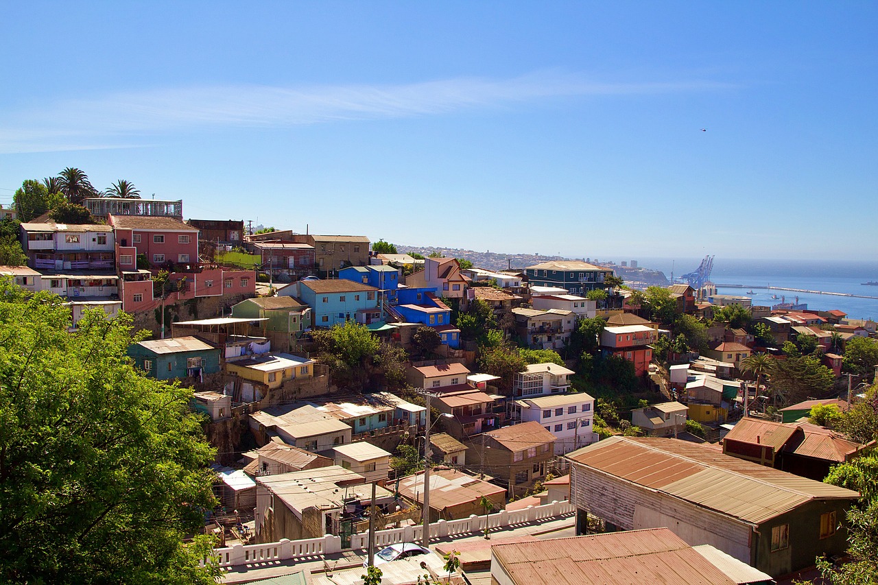 a view of a city from the top of a hill, by Felipe Seade, shutterstock, in chuquicamata, shanty townships, sunny day, house