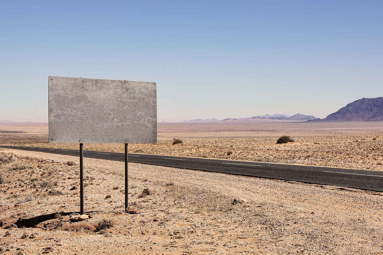 a road sign in the middle of the desert, by Richard Carline, postminimalism, large scale scene, peter guthrie, commercial banner, frederik heyman