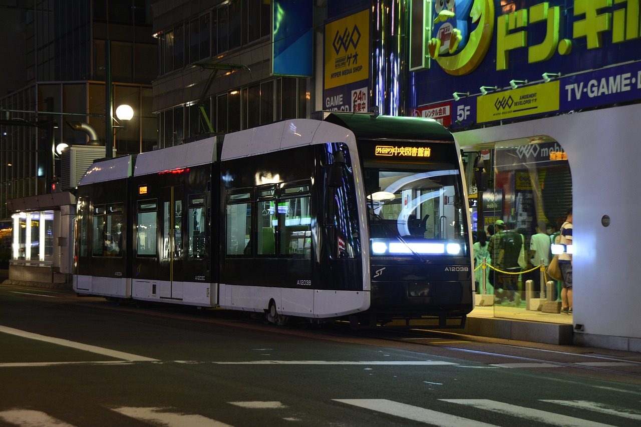 a public transit bus on a city street at night, a picture, flickr, sōsaku hanga, street tram, hyperreal - h 6 4 0, 4k high res, nagasaki