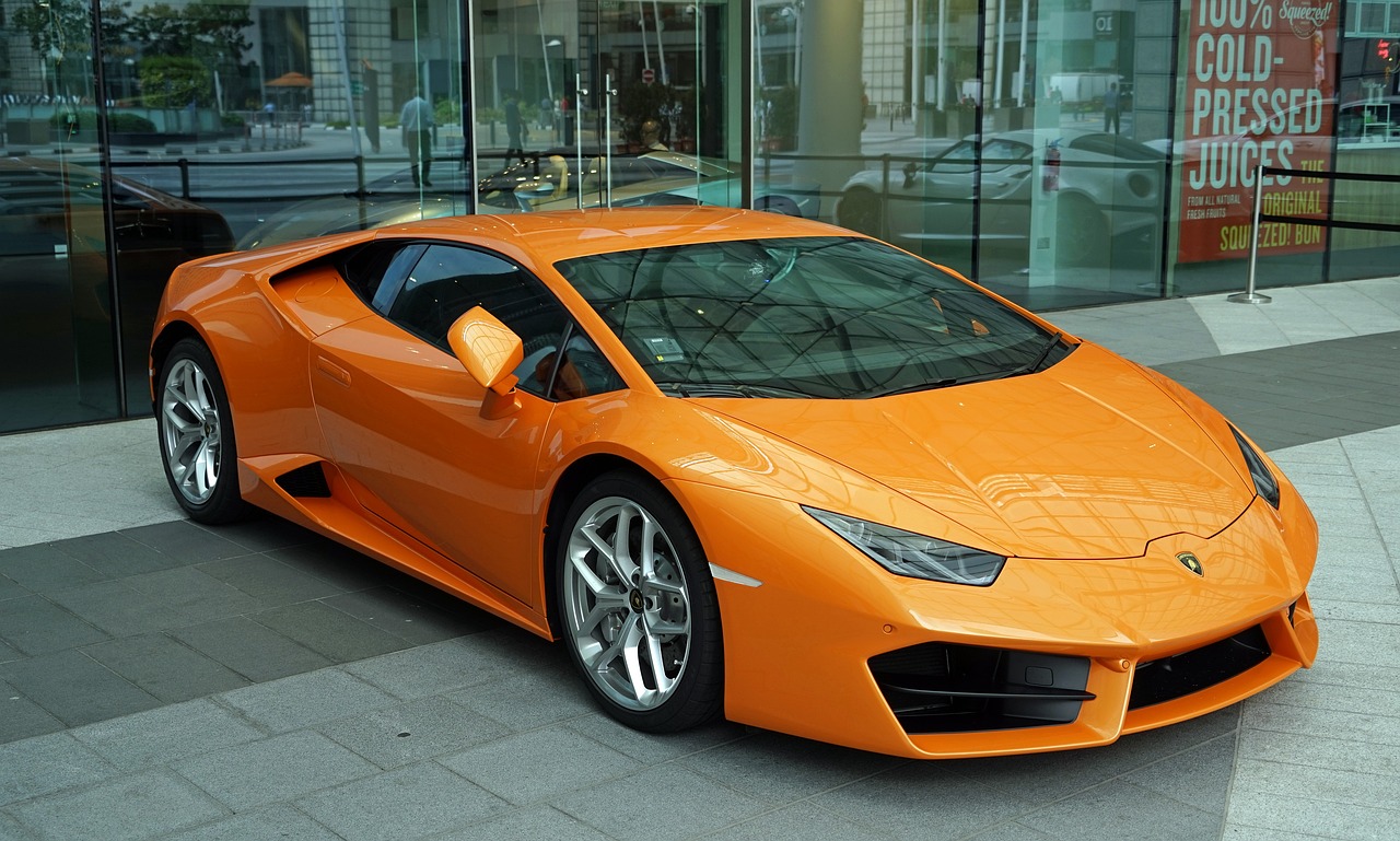 an orange sports car parked in front of a building, 😃😀😄☺🙃😉😗, very expensive, lamborghini, tinted colours