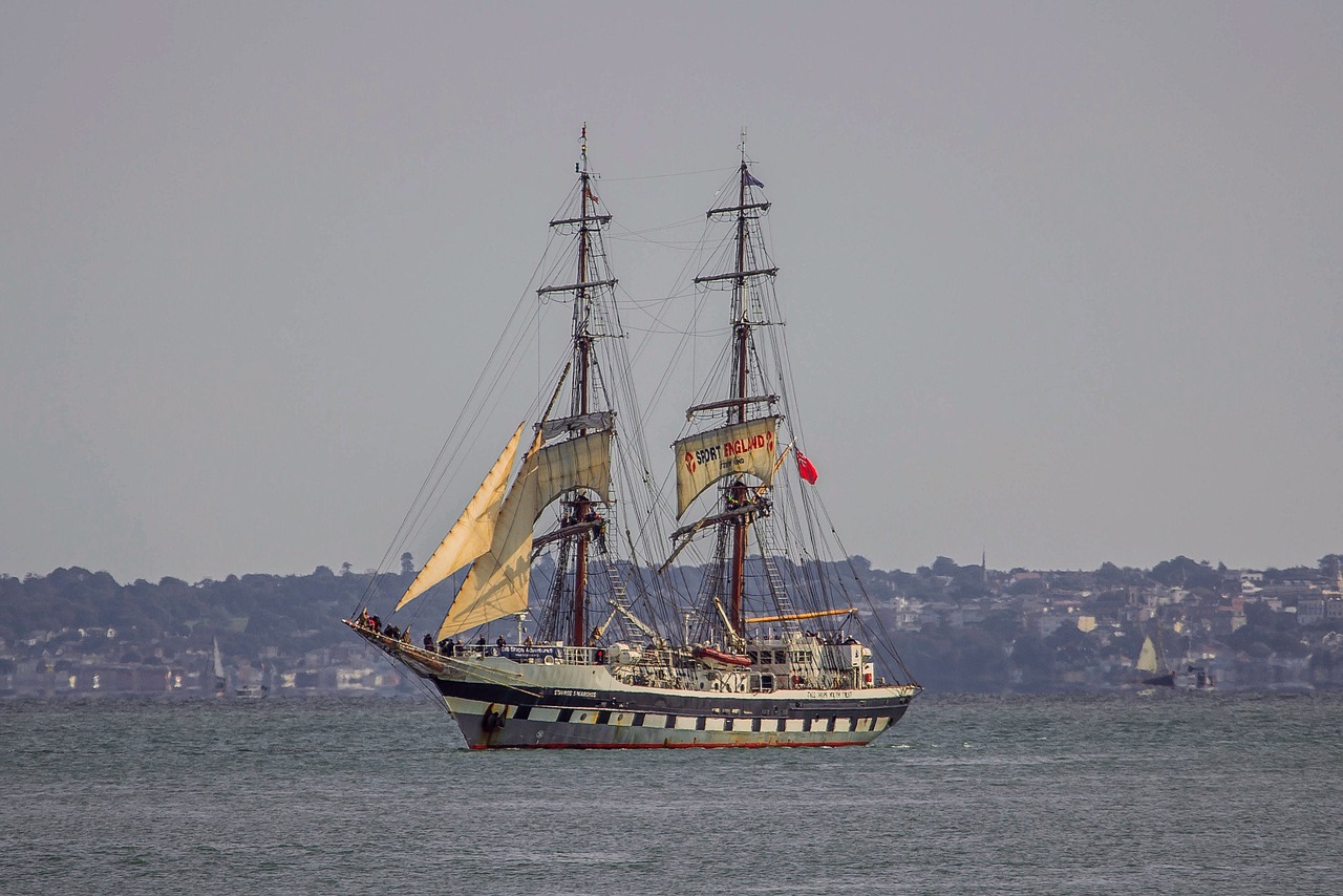 a large sail boat floating on top of a body of water, a portrait, inspired by Horatio Nelson Poole, shutterstock, figuration libre, 2 0 0 mm telephoto, wellington, victorian fire ship, shot on nikon z9