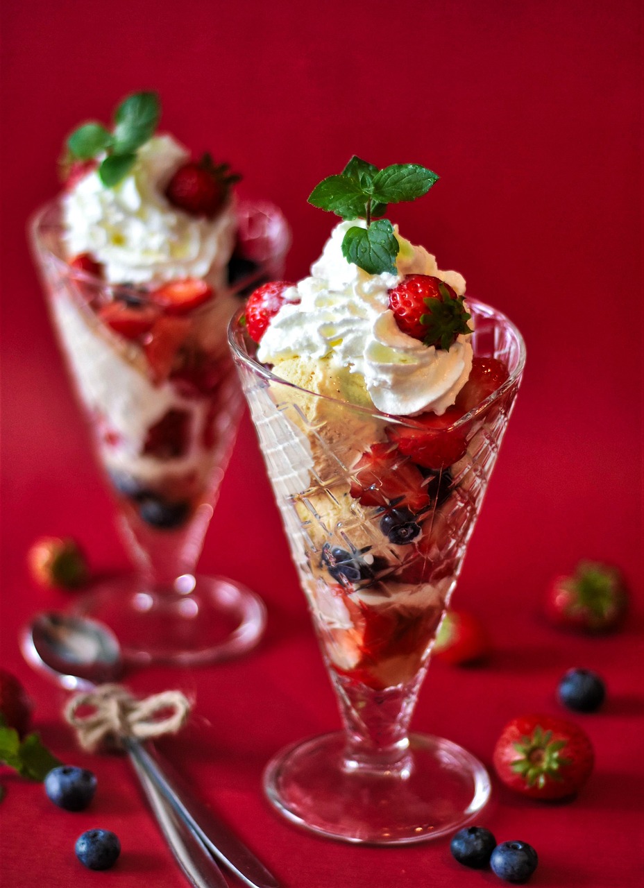 a couple of desserts sitting on top of a table, by Kiyoshi Yamashita, pixabay, renaissance, strawberry ice cream, 1940s food photography, sea of parfait, multi - layer