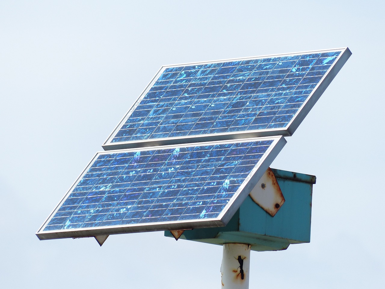 a close up of a solar panel on a pole, a portrait, pixabay, bauhaus, blue backlight, platform, well worn, photo taken on a nikon