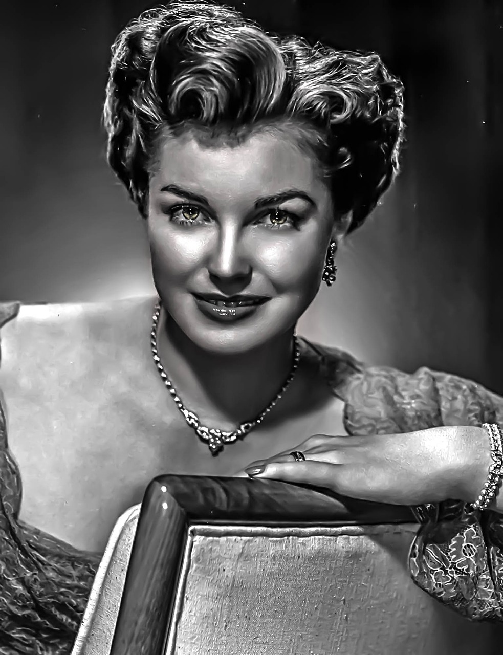 a black and white photo of a woman posing for a picture, digital art, inspired by Yousuf Karsh, trending on pixabay, digital art, rebecca romijn as dorothy, smile 1950s, elegant digital painting, vintage closeup photograph