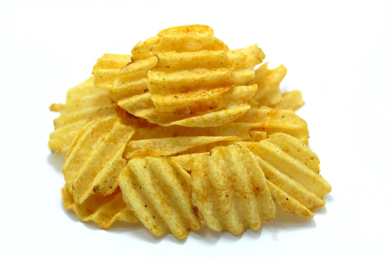 a pile of potato chips on a white surface, a picture, renaissance, product introduction photo, spicy, hard lines, view from the back