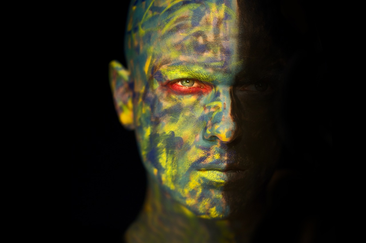 a close up of a person with a painted face, an airbrush painting, inspired by Ed Paschke, featured on zbrush central, portrait of kratos, fractal human silhouette, as atlantean reptilian warriors, close up portrait photo