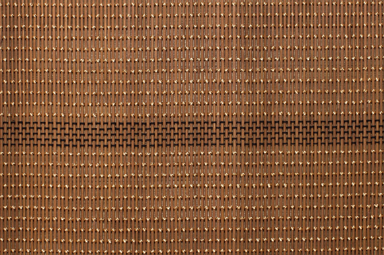 a close up of a brown woven cloth, a digital rendering, by Andreas Gursky, shutterstock, art deco, beads, floor grills, speech, “ golden chalice