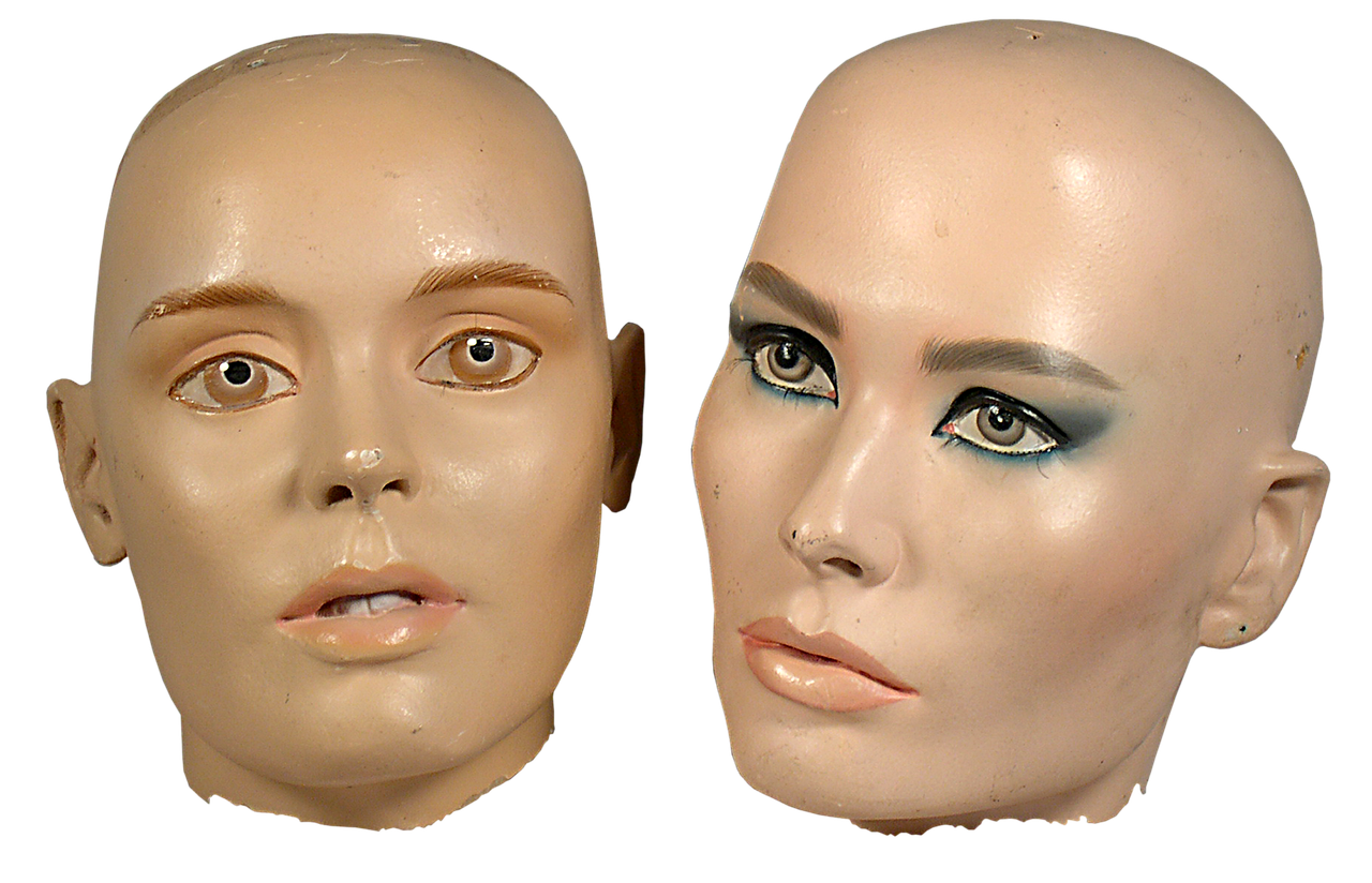 a couple of mannequin heads sitting next to each other, a portrait, by Edward Corbett, trending on zbrush central, 1 9 8 0 s and 1 9 2 0 s airbrush, doll face, rectangular face, prosthetic makeup