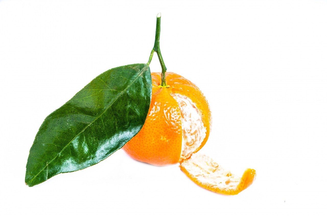 a close up of an orange with a leaf on it, official product photo, crushed, made of glazed, right side composition