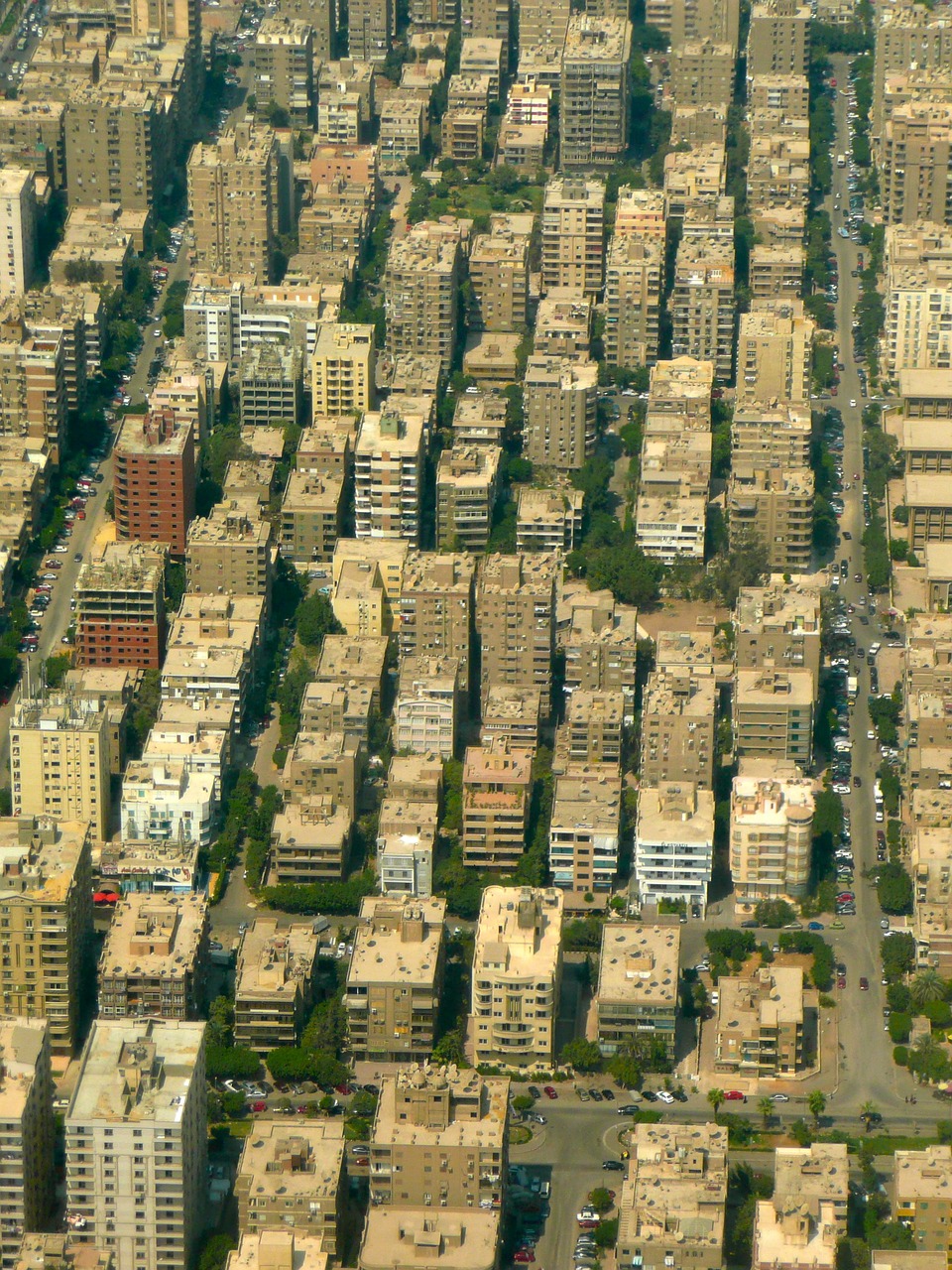 a large city filled with lots of tall buildings, by Ahmed Karahisari, dau-al-set, view from above from plane, cairo, lots of windows, 5 7 9