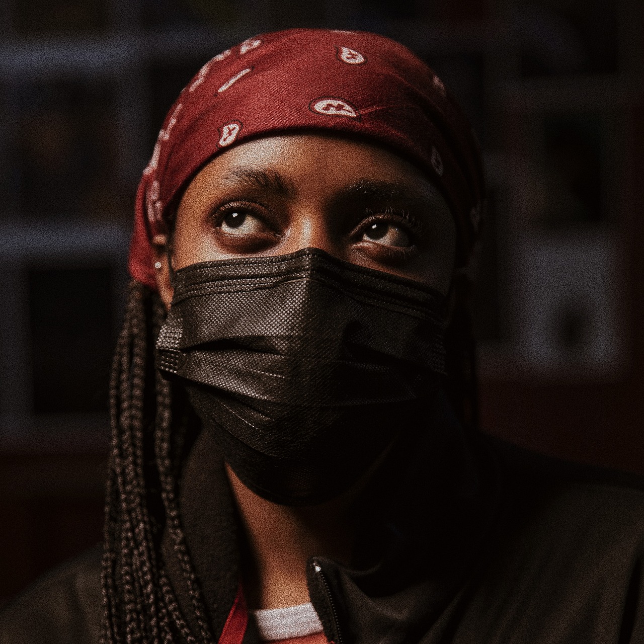 a close up of a person wearing a face mask, a portrait, she is wearing streetwear, riyahd cassiem, dimly - lit, bandana