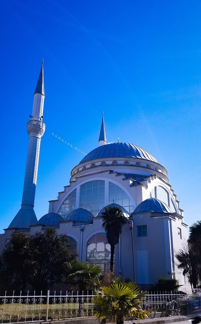 a large white building with a blue dome, a photo, hurufiyya, spire, sky line, ham, photo taken in 2018
