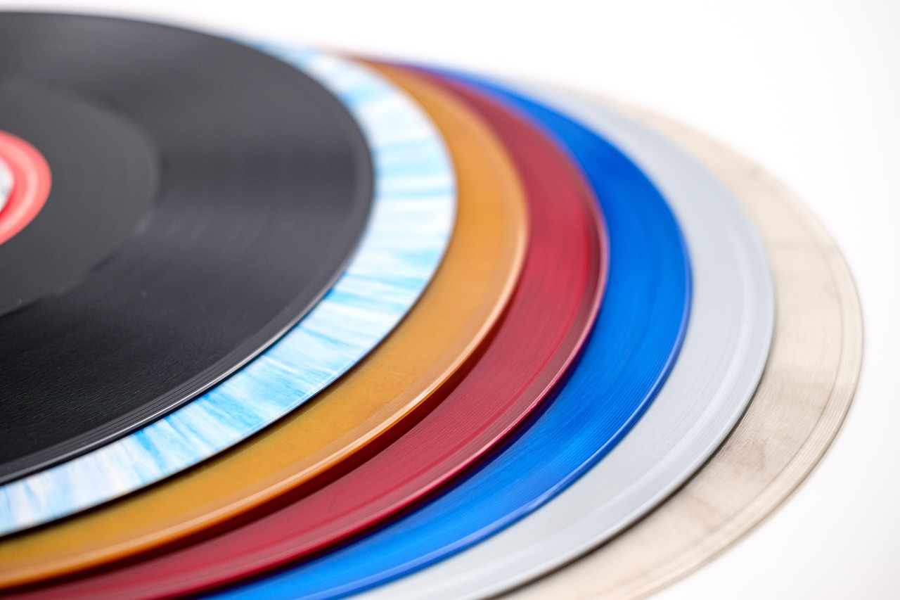 a stack of vinyl records sitting on top of each other, by Doug Ohlson, plasticien, fine color lines, epoxy resin, productphoto, closeup photo