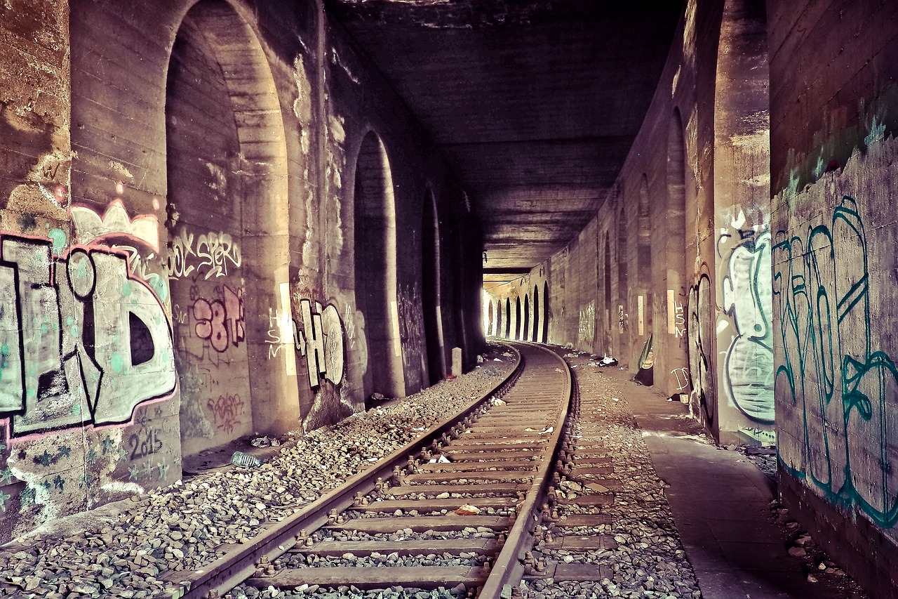 a train track that has some graffiti on it, flickr, graffiti, dry archways, vintage saturation, catacombs, toronto