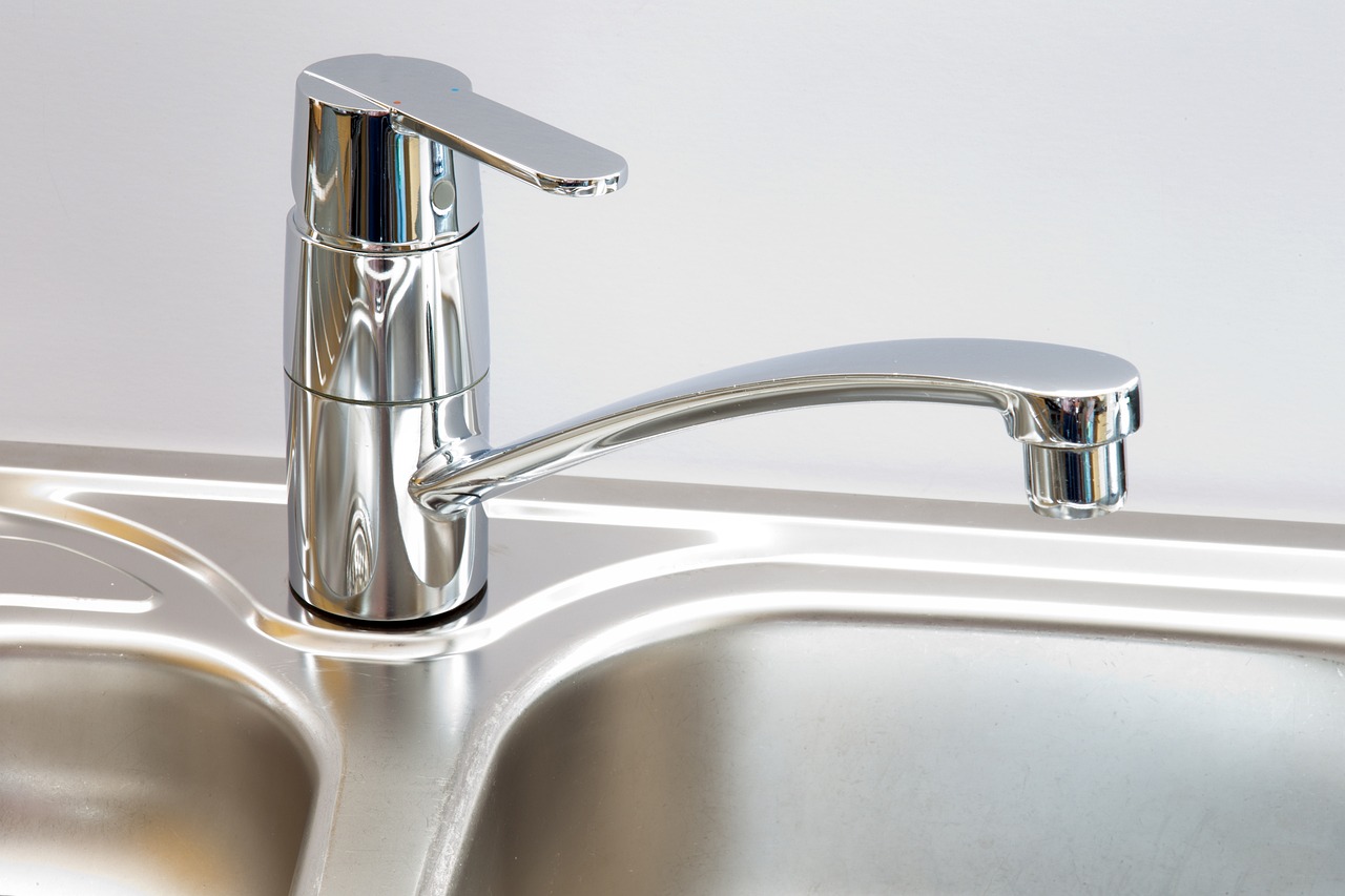 a stainless steel sink with a chrome faucet, a portrait, by Arthur Sarkissian, shutterstock, high detailed photo, aluminum, enamel, close-up photo