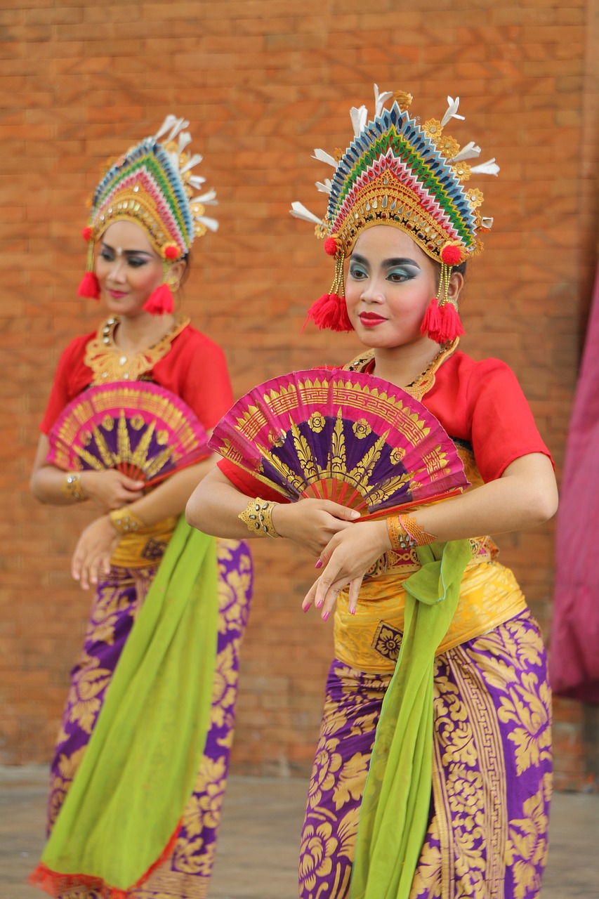 a couple of women standing next to each other, inspired by I Ketut Soki, shutterstock, female dancer, closeup photo, stock photo