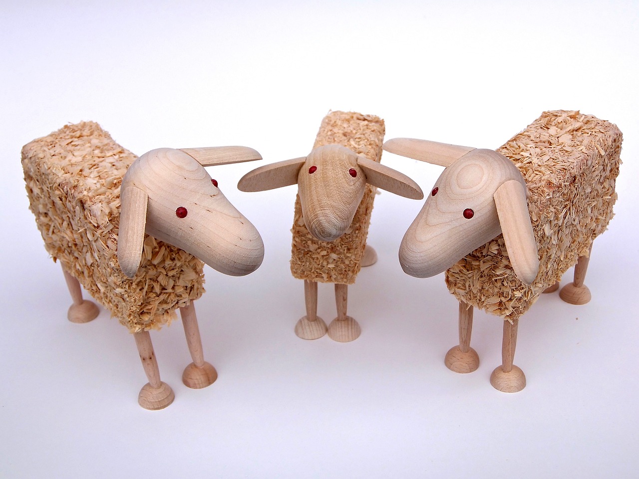 a couple of wooden sheep standing next to each other, by Dietmar Damerau, flickr, mingei, straw, trio, product introduction photo, highly detailed product photo