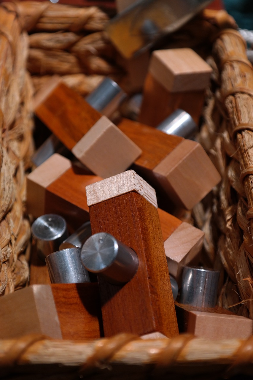 a basket filled with wooden blocks and nails, a picture, detailed zoom photo, modern high sharpness photo, knobs, crosses