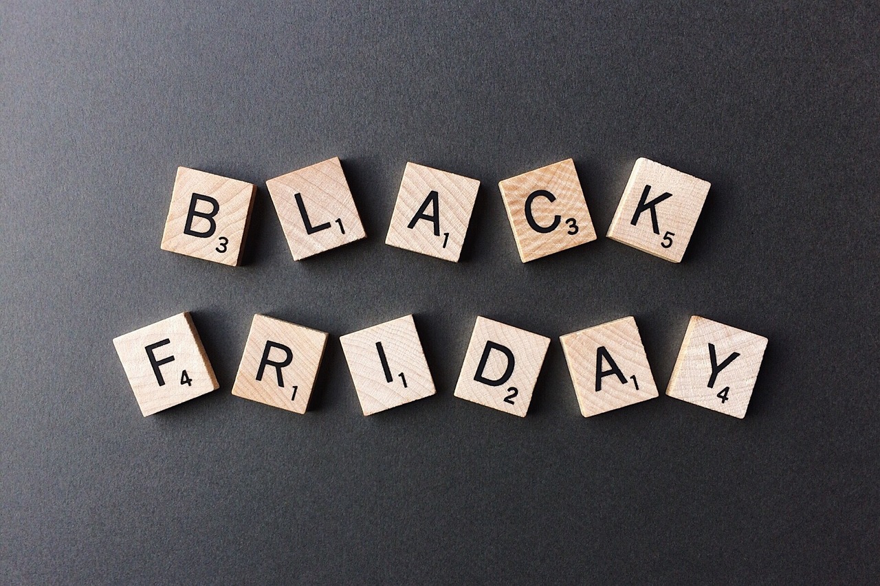 wooden blocks spelling black friday on a black surface, by Alexander Fedosav, pixabay, graffiti, 🦩🪐🐞👩🏻🦳, black squares on 4 corners, wikipedia, folded