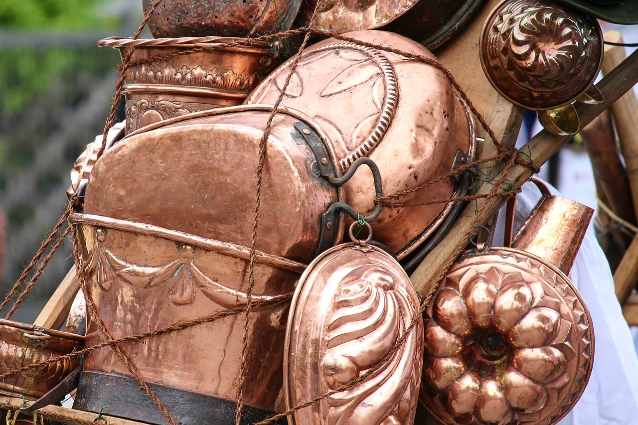 a close up of a bunch of copper objects, flickr, renaissance, hillside, photo taken on a nikon, cuisine, closeup - view