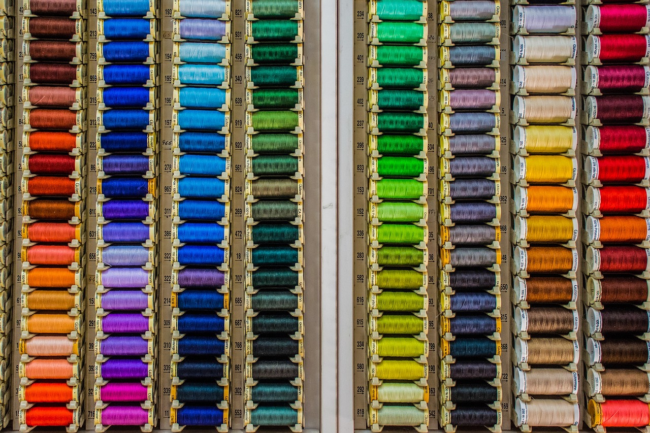 a row of spools of different colors of thread, a cross stitch, inspired by Andreas Gursky, trending on pexels, color field, color ( sony a 7 r iv, chalk, color”, on display