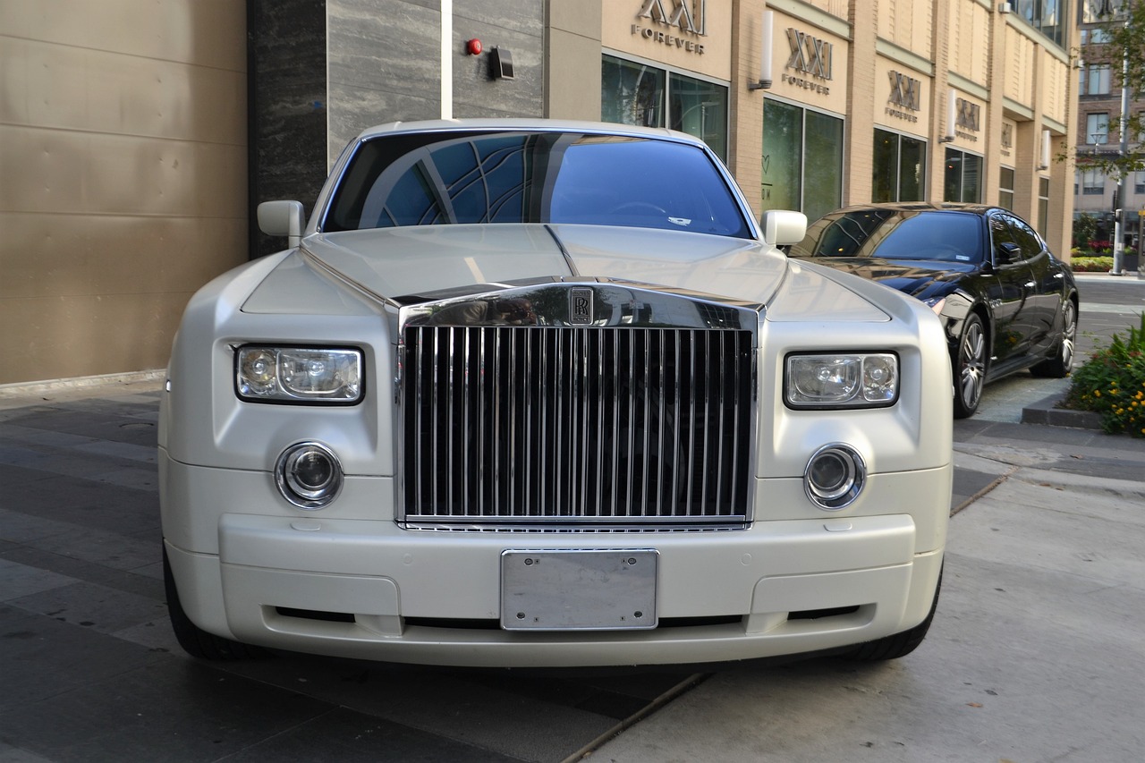 a white rolls royce parked in front of a building, by Alexander Robertson, flickr, renaissance, with symmetrical facial features, usa-sep 20, glossy white armor, trimmed with a white stripe