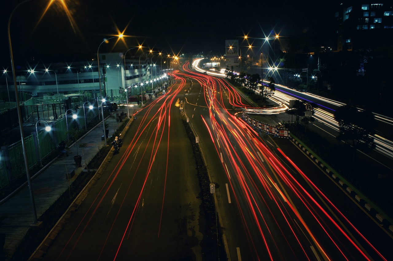 a city street filled with lots of traffic at night, by Max Dauthendey, pexels, bangalore, long exposure photo, speed lines, flash photo