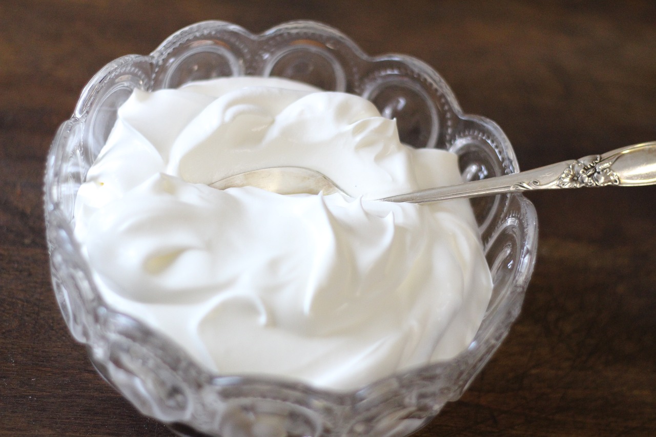 a bowl of whipped cream with a spoon in it, hurufiyya, jelly - like texture, photograph credit: ap, test, miranda meeks