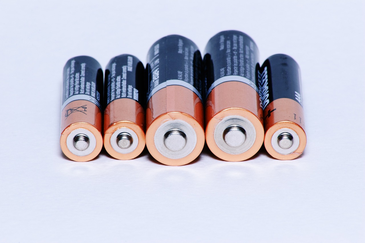 a group of batteries sitting on top of a white surface, a picture, by Alexander Fedosav, wikimedia commons, ultra accurate, anime shot, product introduction photo