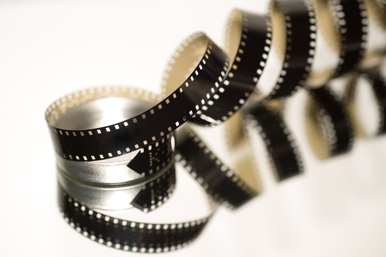 a roll of film sitting on top of a table, a picture, macro 8mm photo, cinematographic photo