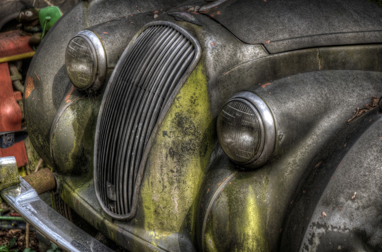 a close up of the front of an old car, by Hans Fischer, flickr, photorealism, hdr on, dirty green clothes, wallpaper!, but very good looking”