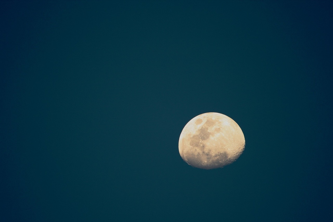 the moon is shining brightly in the blue sky, minimalism, photo 85mm, wide portrait, minimalism, telephoto