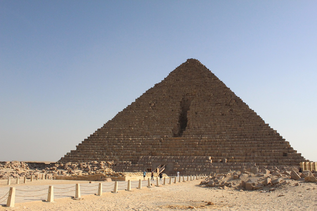 a large pyramid sitting in the middle of a desert, egyptian art, over-shoulder shot, ancient megastructure pyramid, last photo, side - view