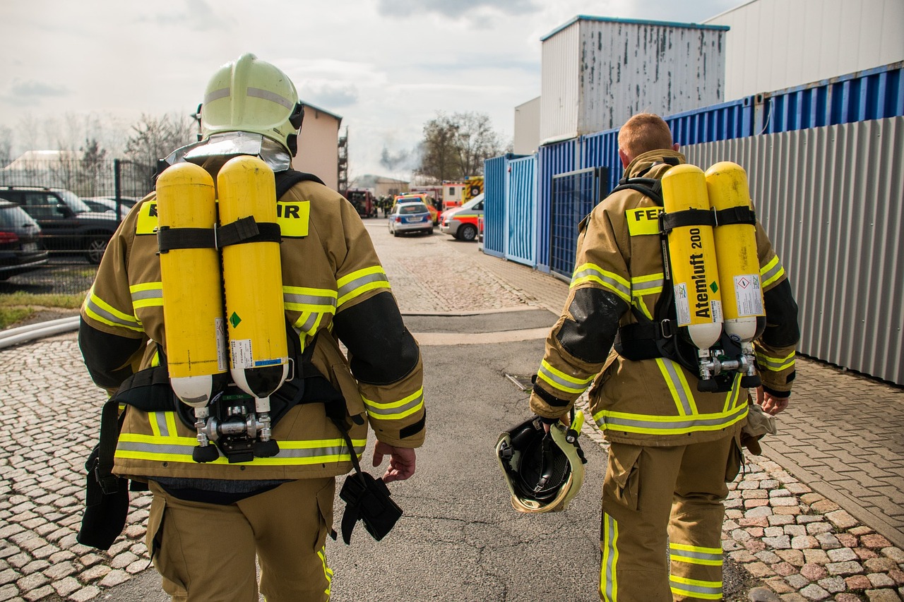 a couple of fire fighters walking down a street, a picture, by Thomas Häfner, shutterstock, footage, training, panorama, harnesses