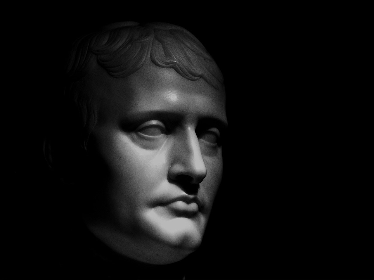 a black and white photo of a bust of a man, a statue, inspired by Horatio McCulloch, featured on zbrush central, realism, dressed like napoleon bonaparte, detailed high contrast lighting, rendered in maya 4 d, portait photo