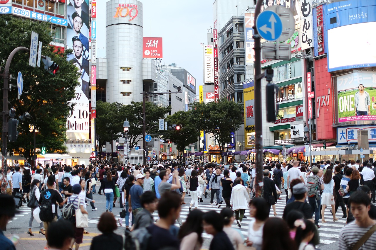 a crowd of people walking across a street next to tall buildings, shin hanga, shibuya crossing, advertising photo, usa-sep 20, with everything in its place