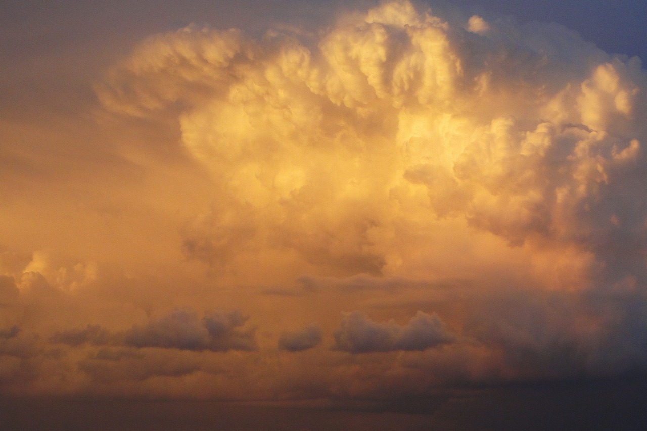 there is a plane that is flying in the sky, by Linda Sutton, flickr, romanticism, evening storm, many golden layers, giant cumulonimbus cloud, 4k still