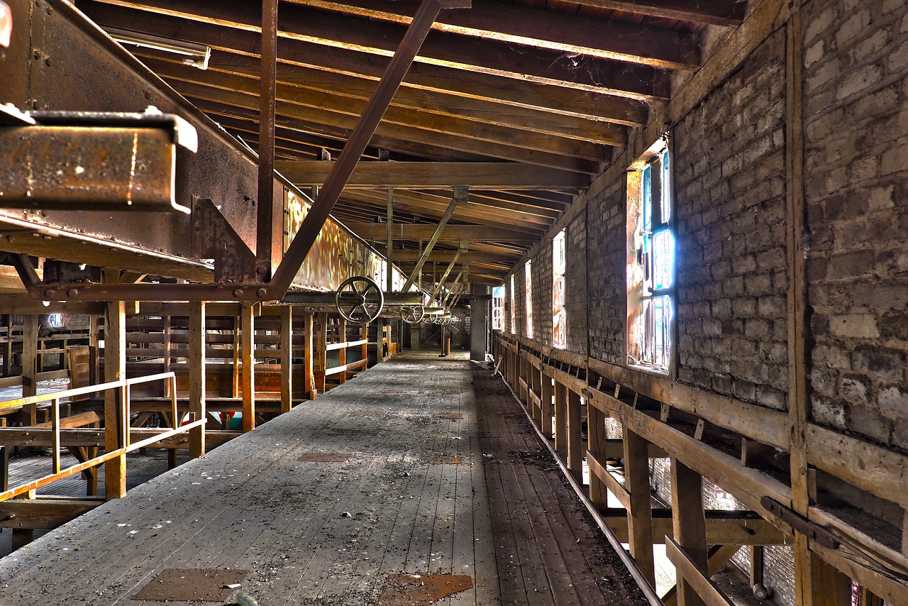 a long room filled with lots of wooden shelves, flickr, old lumber mill remains, color”, stained”, catwalk